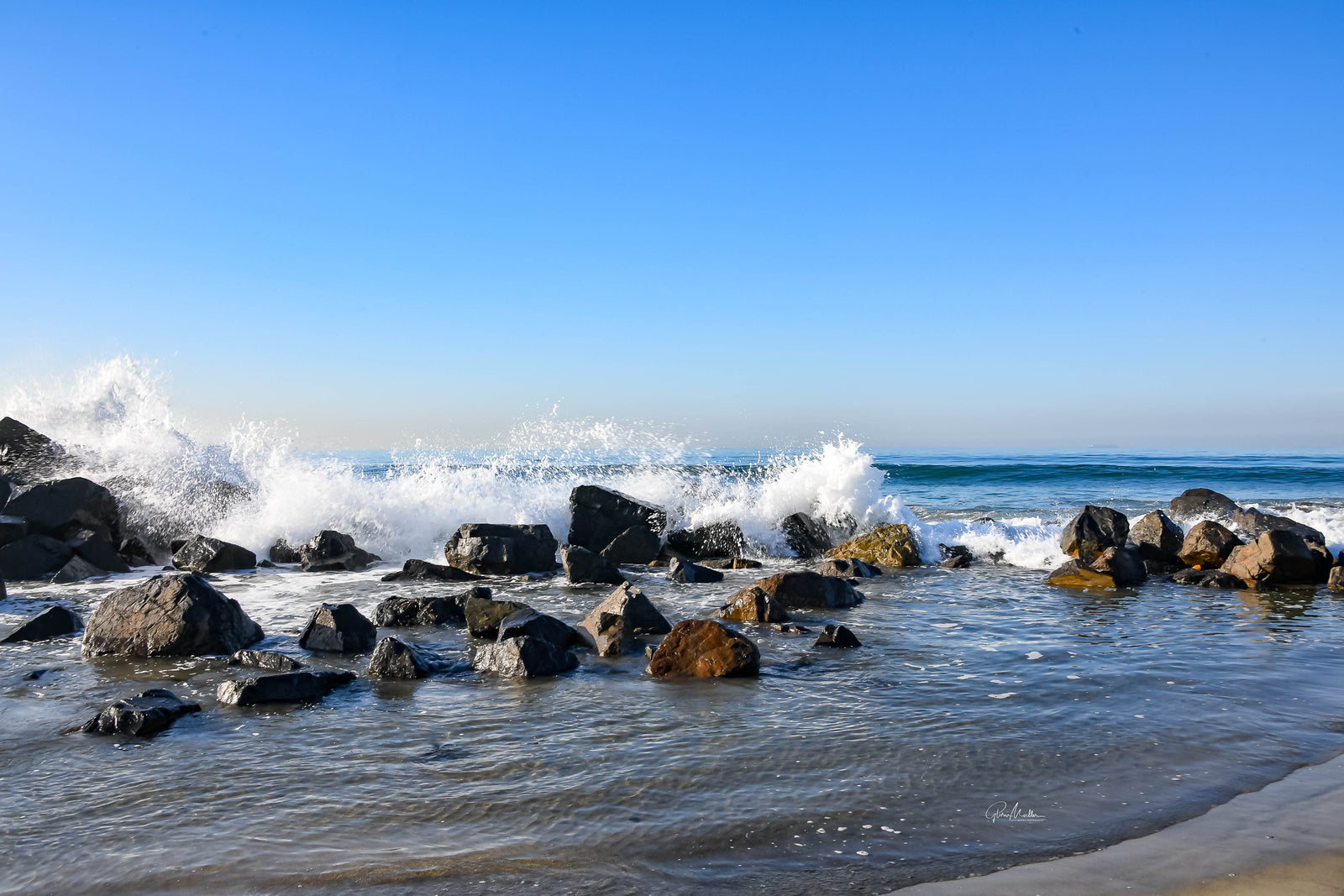 Waves Cresting Over the Jetty
